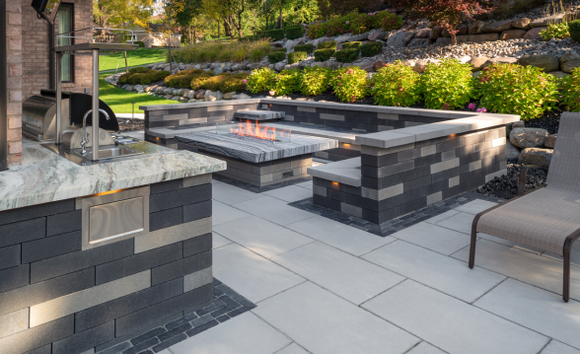 back yard with a brick work fireplace and seating area