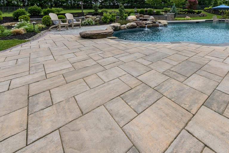 Pool deck made out of sandstone coloured bricks